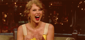 Taylor-Swift-Laughing-Covering-Face-520x245