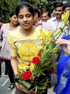 New Delhi: M Gayatri, who topped the CBSE Class 12 Board Exams 2015, is greeted at her school in New Delhi on Monday. PTI Photo  (PTI5_25_2015_000196A)